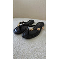 Claquettes noires détails dorés