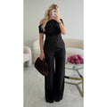 Top lin noir drapé asymétrique